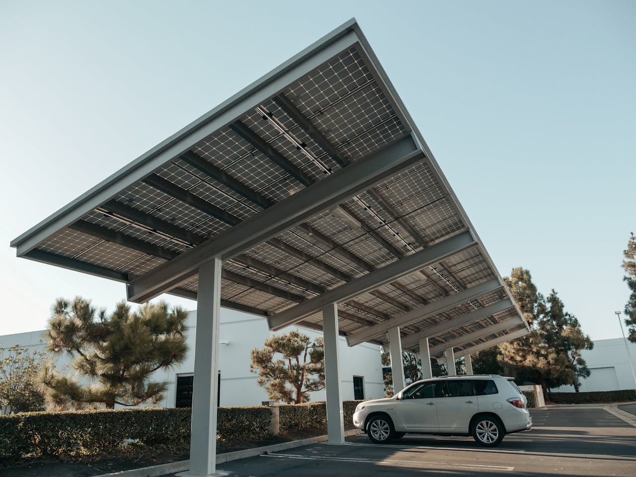 Solar panel carport in a modern urban setting, showcasing clean energy solutions.